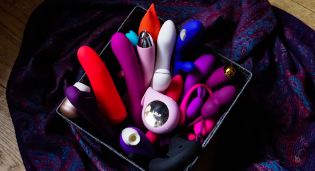 A basket full of different kinds of vibrators and dildos
