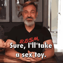 A man saying “Sure, I’ll take a sex toy.