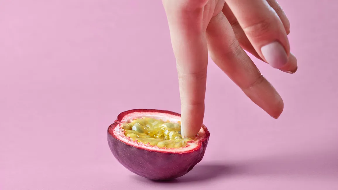 Fingers inside a fruit