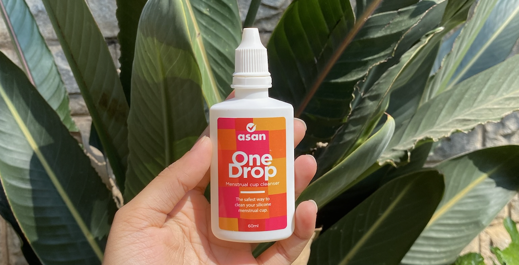 hand holding the Asan One-Drop menstrual cup cleanser